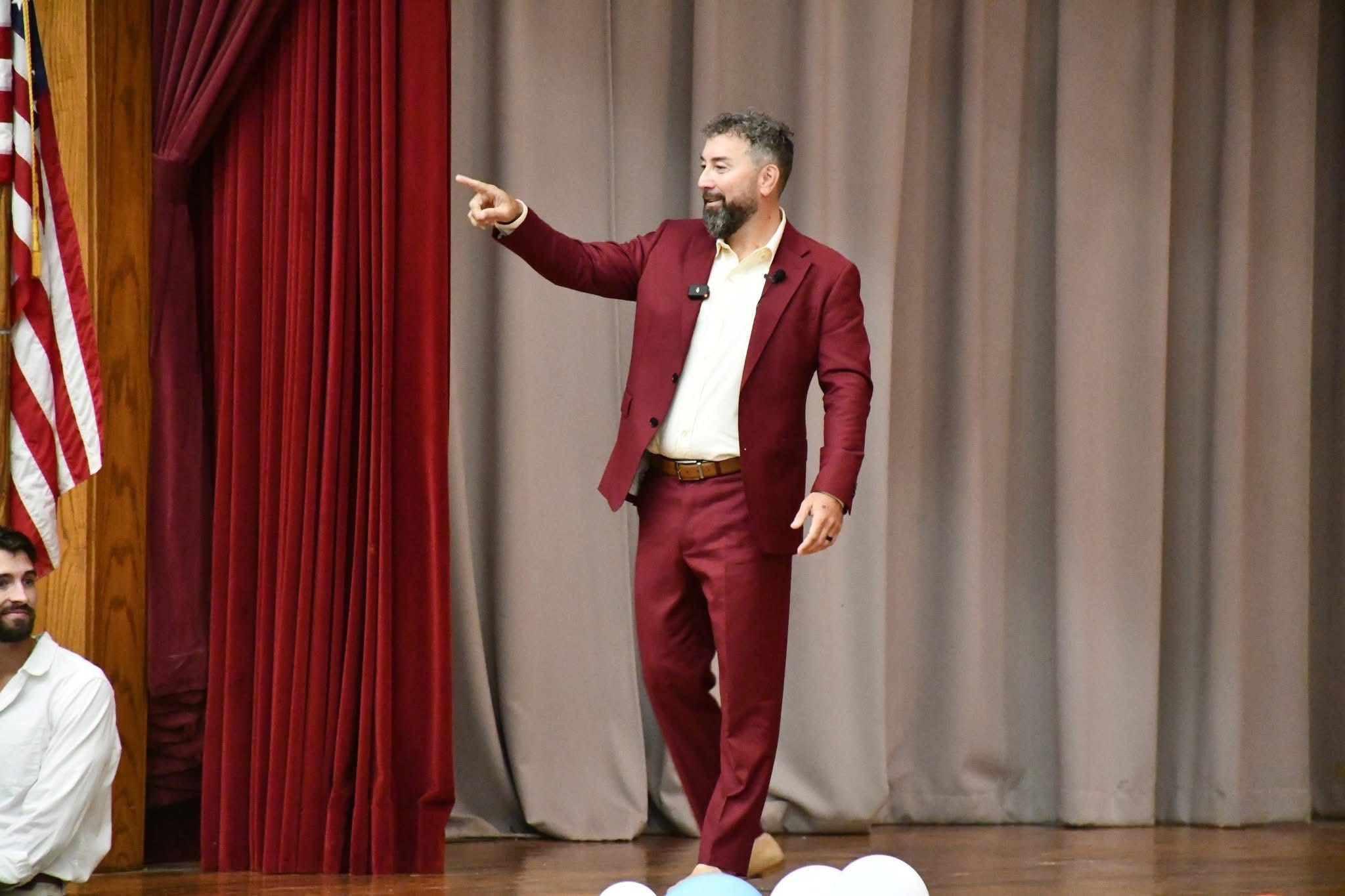 Morgan Wiles speaking on stage